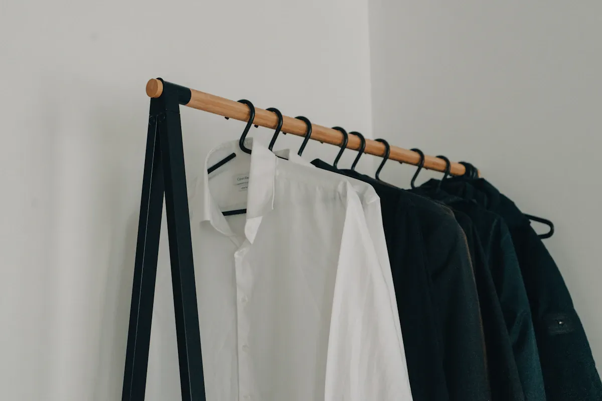 A white dress shirt on a black clothes hanger