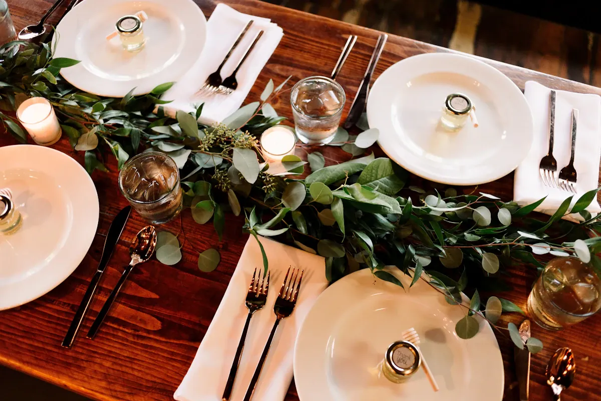 White ceramic dinner plates on a wooden table