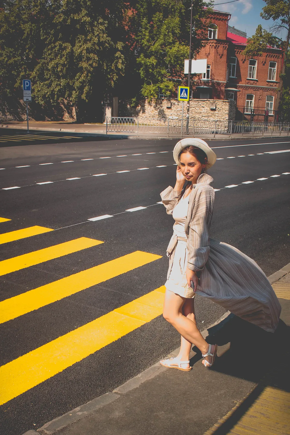 A woman wearing a brown dress